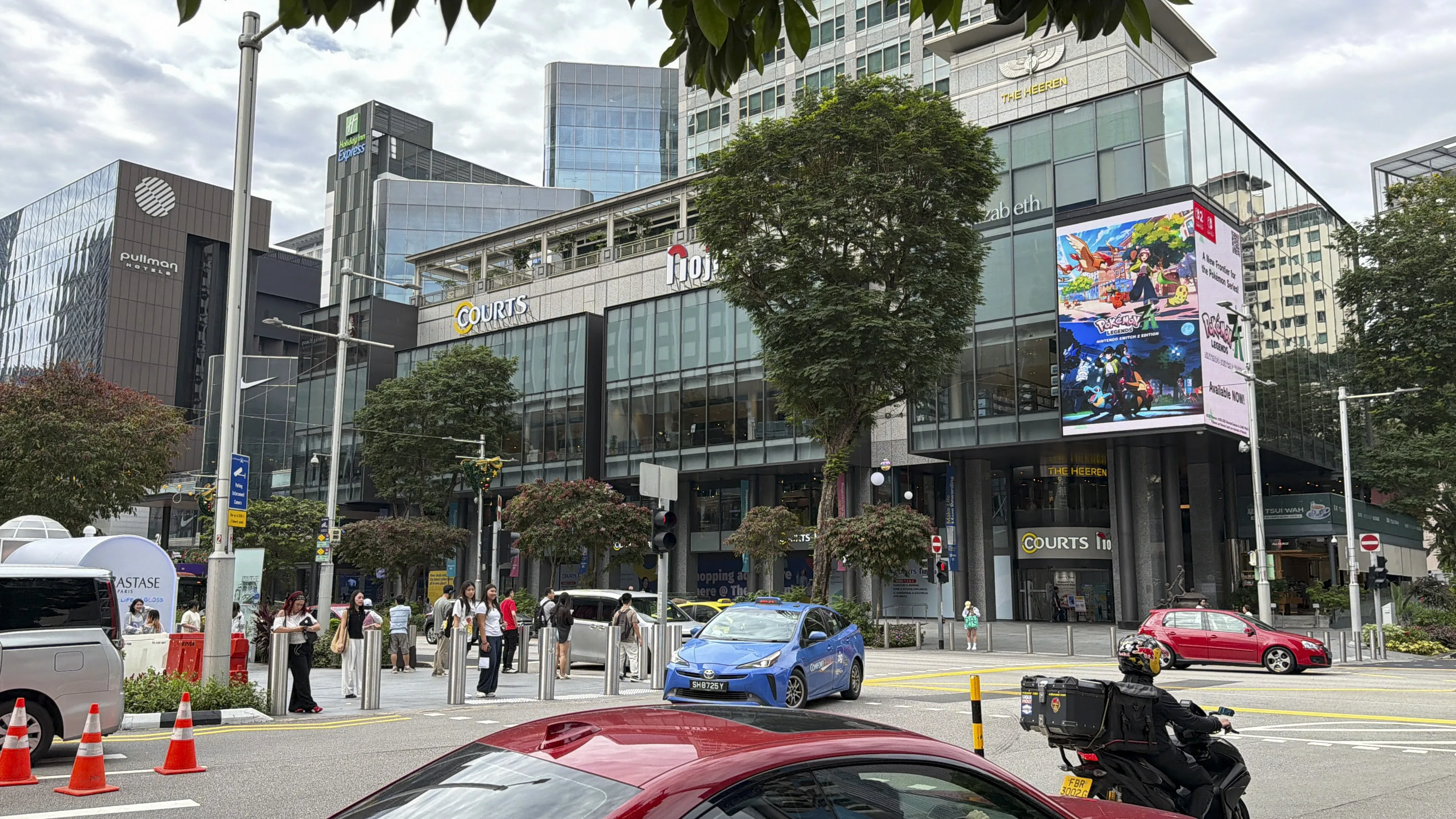 Pokémon branded outdoor advertising campaign creative on large-format LED screen in Singapore